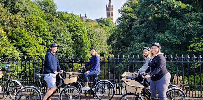Guests biking near Glasgow University on the Glasgow Highlights Bike Tour.