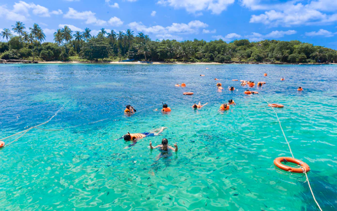 Snorkelers exploring clear waters during 3 Island Hopping Tour in Phu Quoc.