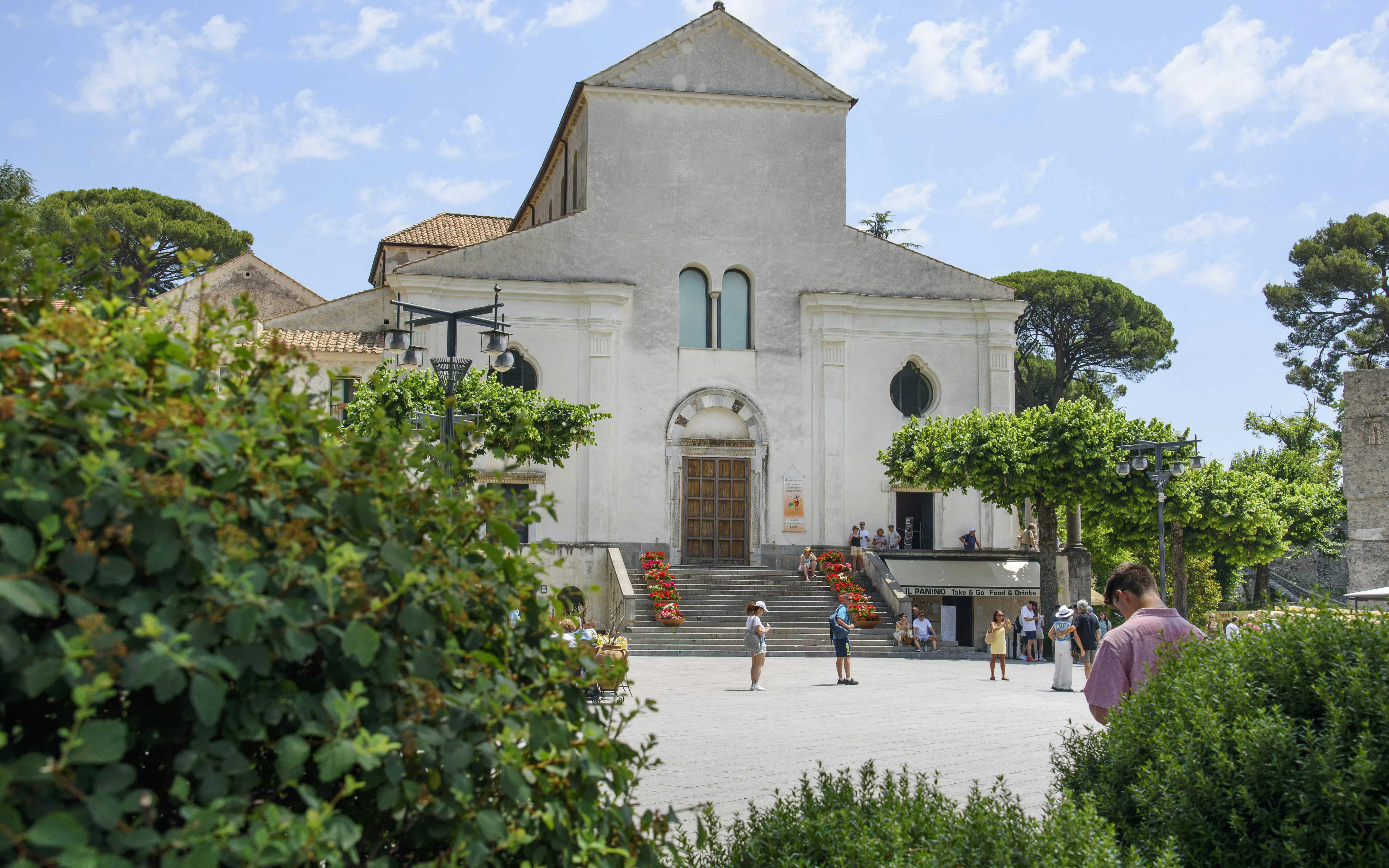 Ravello Cathedral facade with visitors, Amalfi Coast.