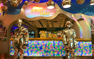 Infinity Maze entrance at Ripley's Believe It Or Not! Museum with mirrored statues.