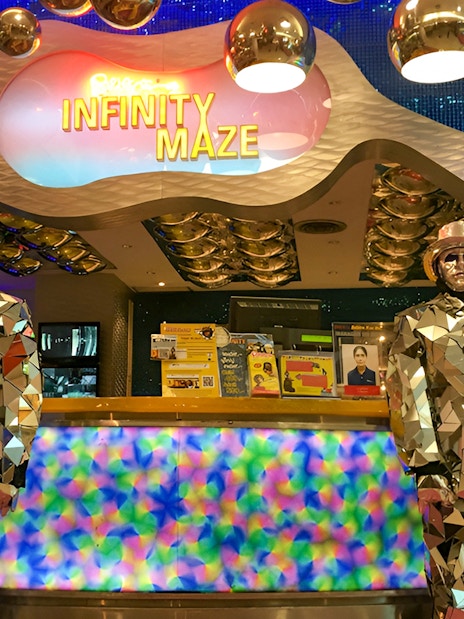 Infinity Maze entrance at Ripley's Believe It Or Not! Museum with mirrored statues.