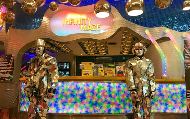 Infinity Maze entrance at Ripley's Believe It Or Not! Museum with mirrored statues.