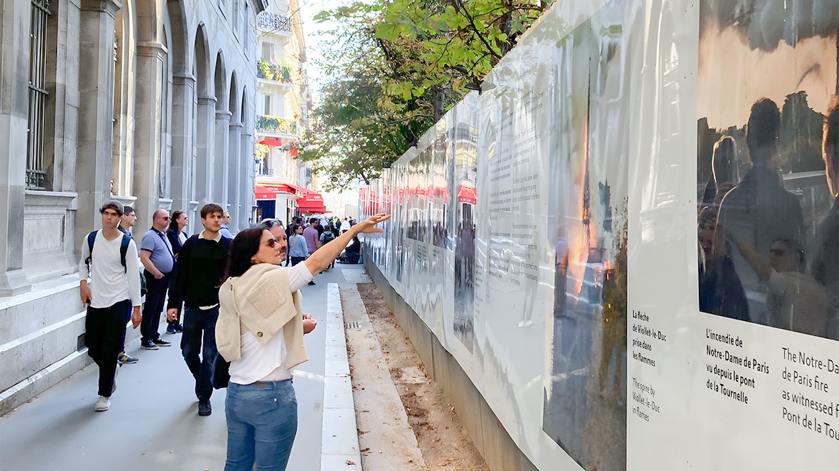 Notre Dame Cathedral facade with tourists on outdoor walking tour, Paris, includes crypt entry.