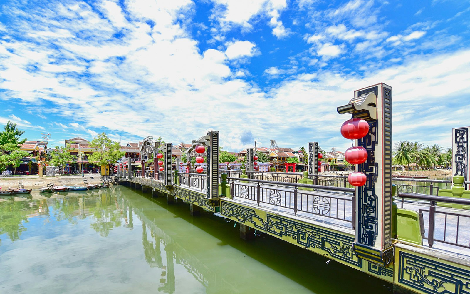 Bridge with red lanterns over Thu Bon River in Hoi An Ancient Town.