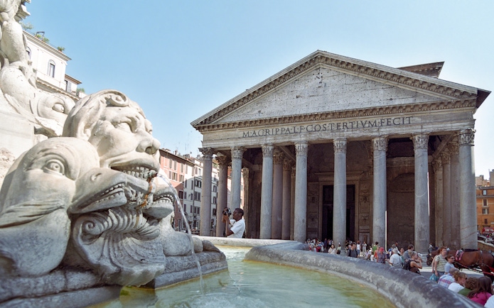 Pantheon entrance with fountain in foreground, Rome, during guided tour.
