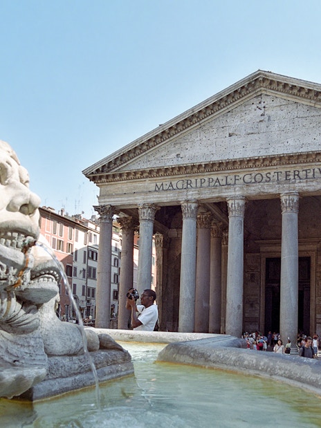 Pantheon entrance with fountain in foreground, Rome, during guided tour.