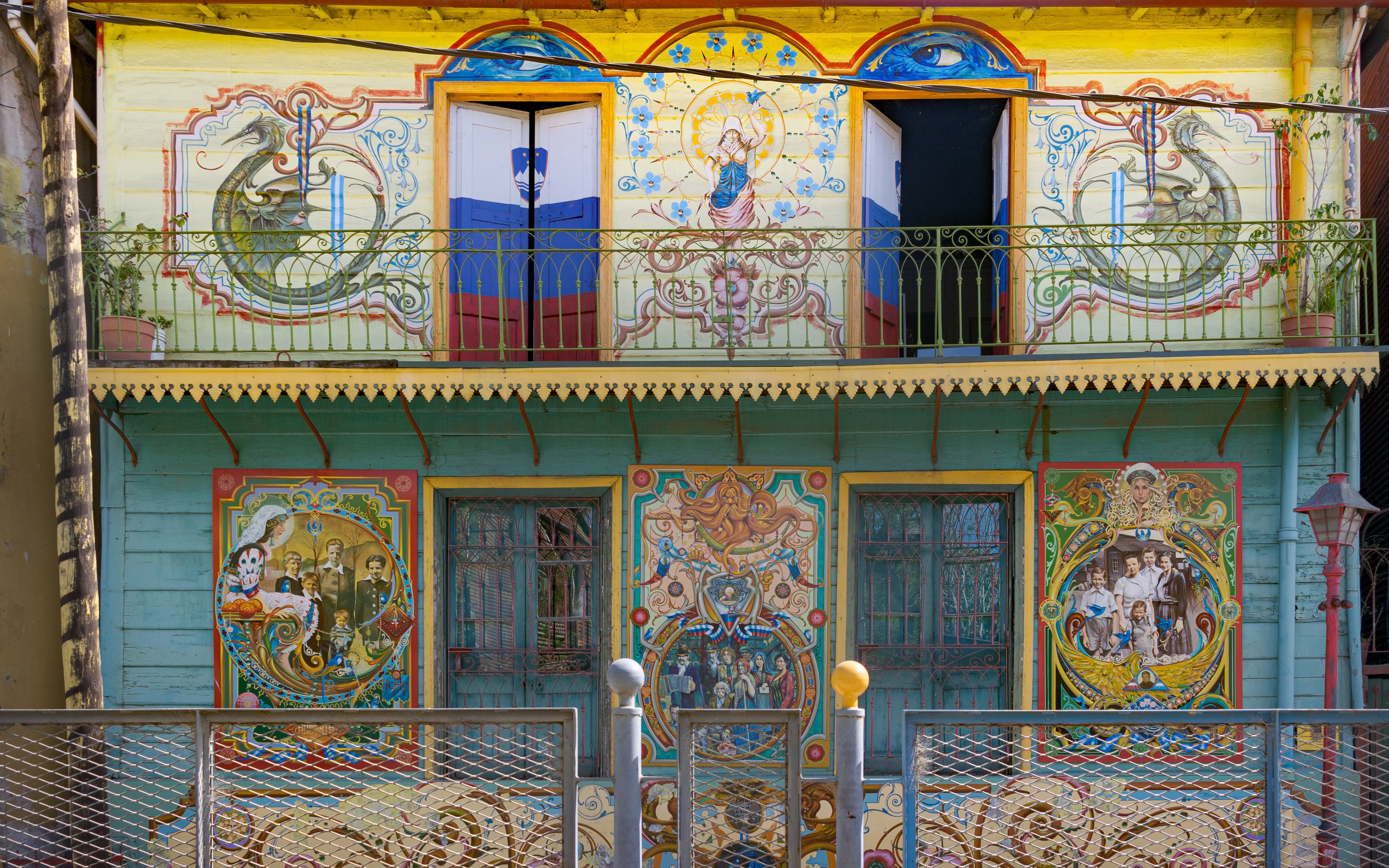 Colorful murals on a balcony in La Boca, Buenos Aires walking tour.