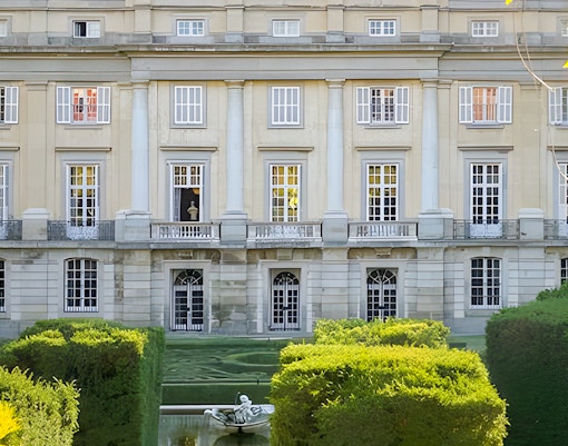 Liria Palace garden with fountain and manicured hedges in Madrid.