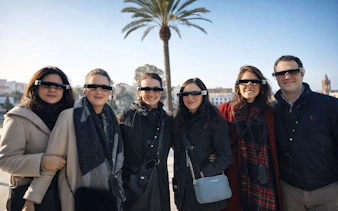 Tourists with guide wearing smart glasses during Setas de Sevilla city tour.