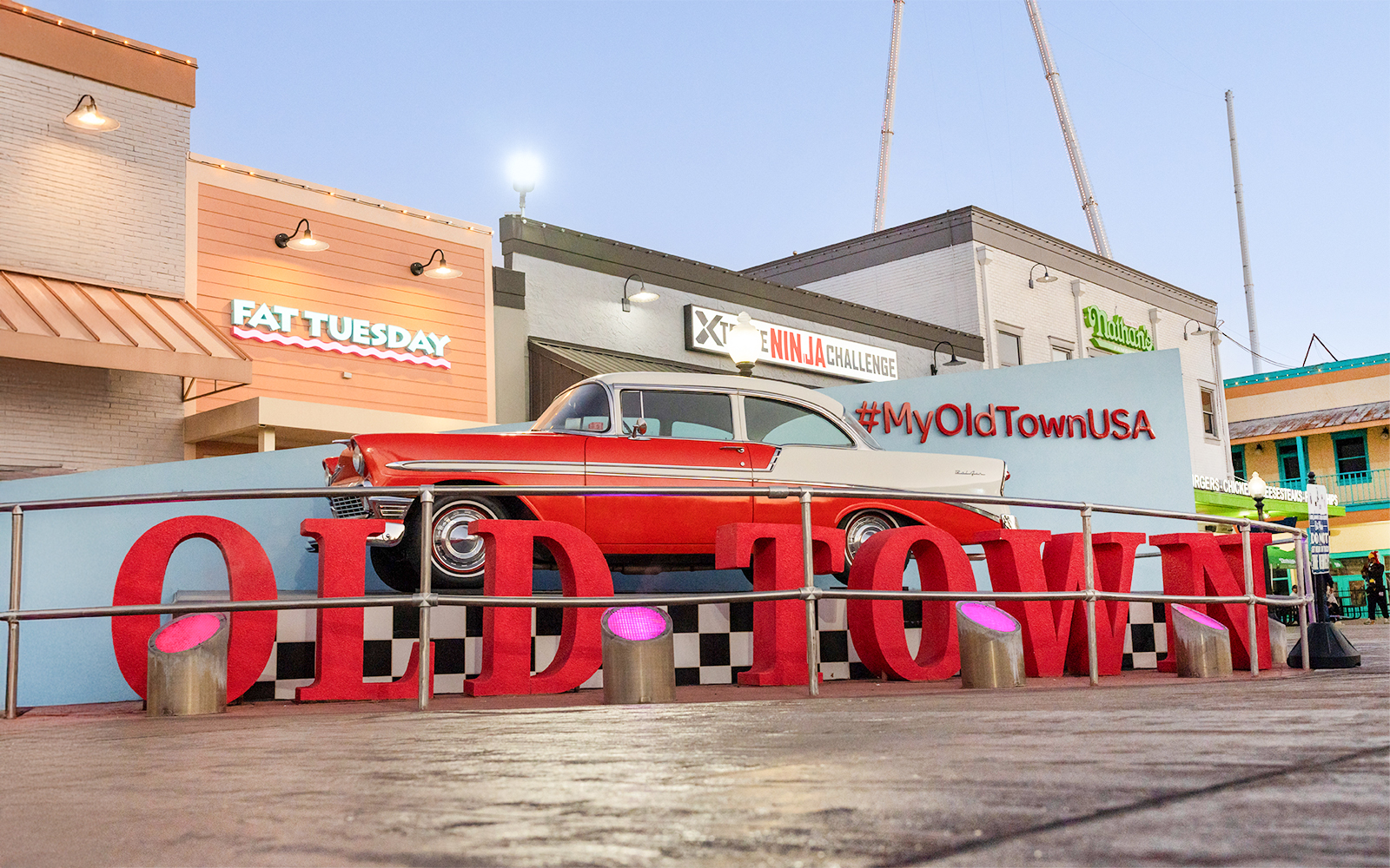 Classic car display at Old Town, Orlando with #MyOldTownUSA sign.