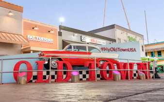 Classic car display at Old Town, Orlando with #MyOldTownUSA sign.