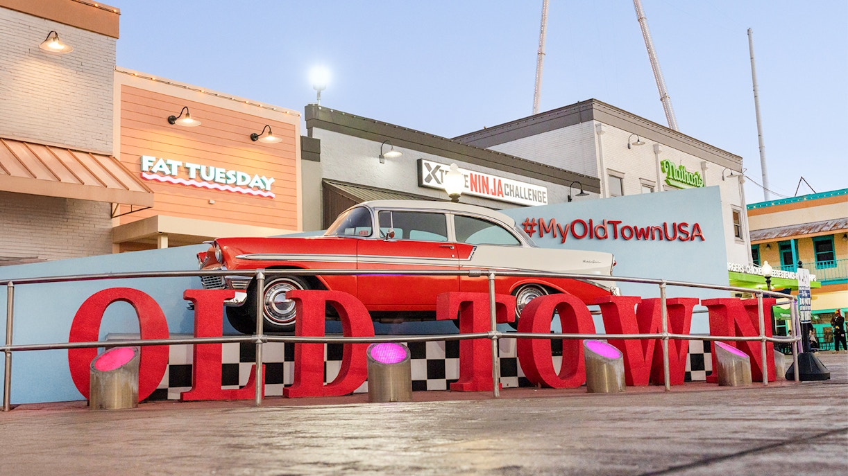 Classic car display at Old Town, Orlando with #MyOldTownUSA sign.