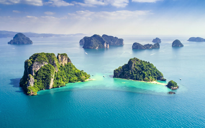 Phi Phi Islands with lush greenery and turquoise waters, viewed from above, Thailand.