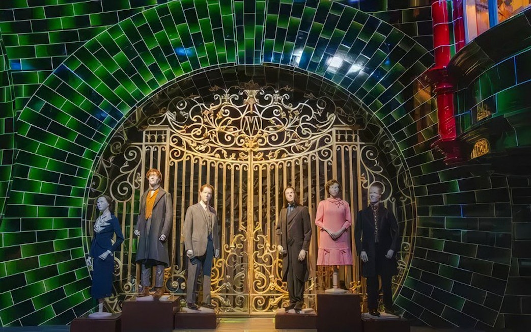 Mannequins in front of ornate gate at Ministry of Magic set, Warner Bros. Studio Tour Tokyo.