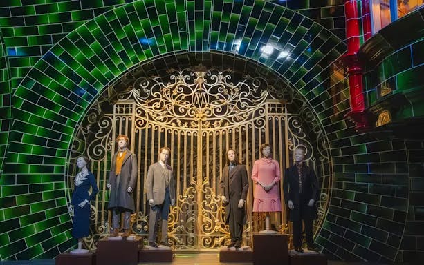 Mannequins in front of ornate gate at Ministry of Magic set, Warner Bros. Studio Tour Tokyo.