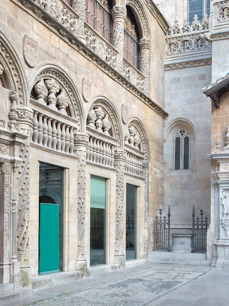 Granada Cathedral ornate stone facade with detailed carvings and arched doorways.
