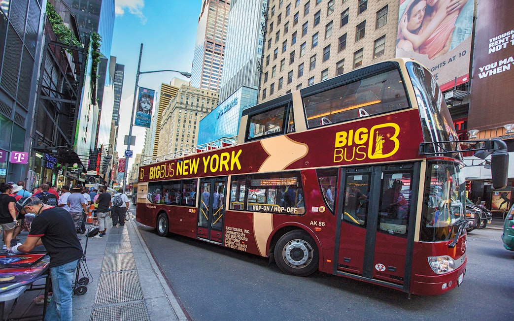 Big Bus tour on a busy street in New York City.