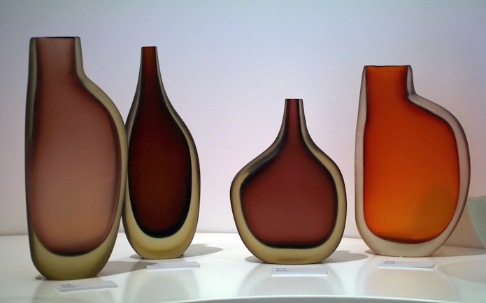 Venetian glass vases displayed in a museum, part of the Venice Museums Pass.