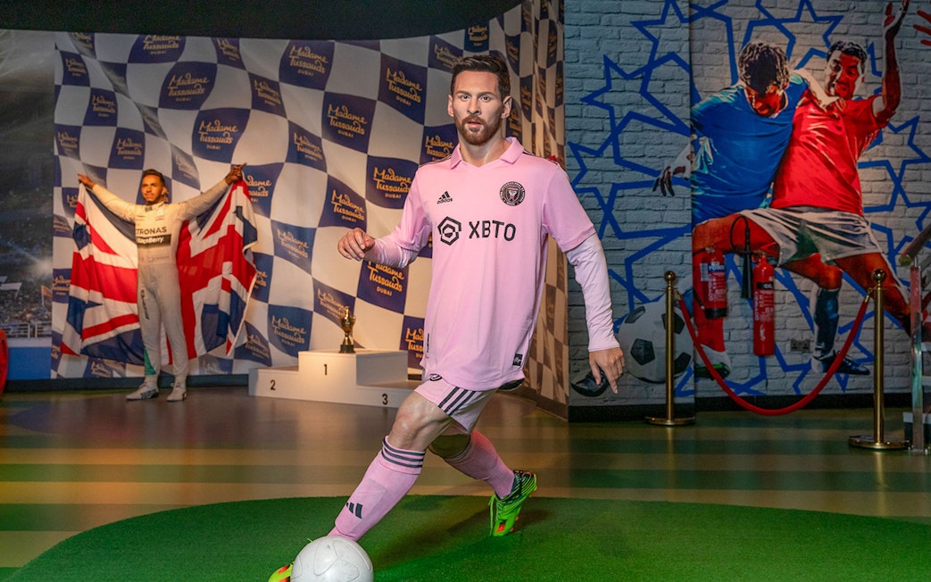 Lionel Messi wax figure in soccer pose at Madame Tussauds Dubai.