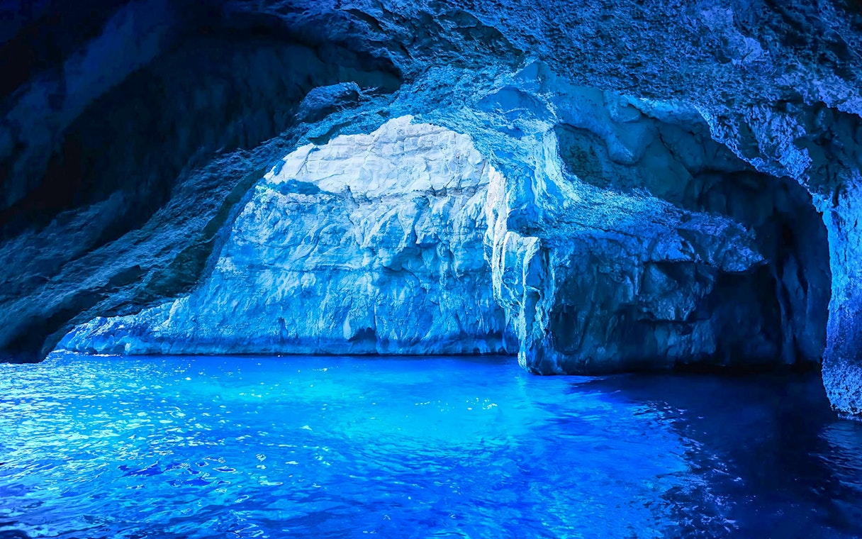 Blue Grotto cave with vibrant blue water, part of a guided tour experience.