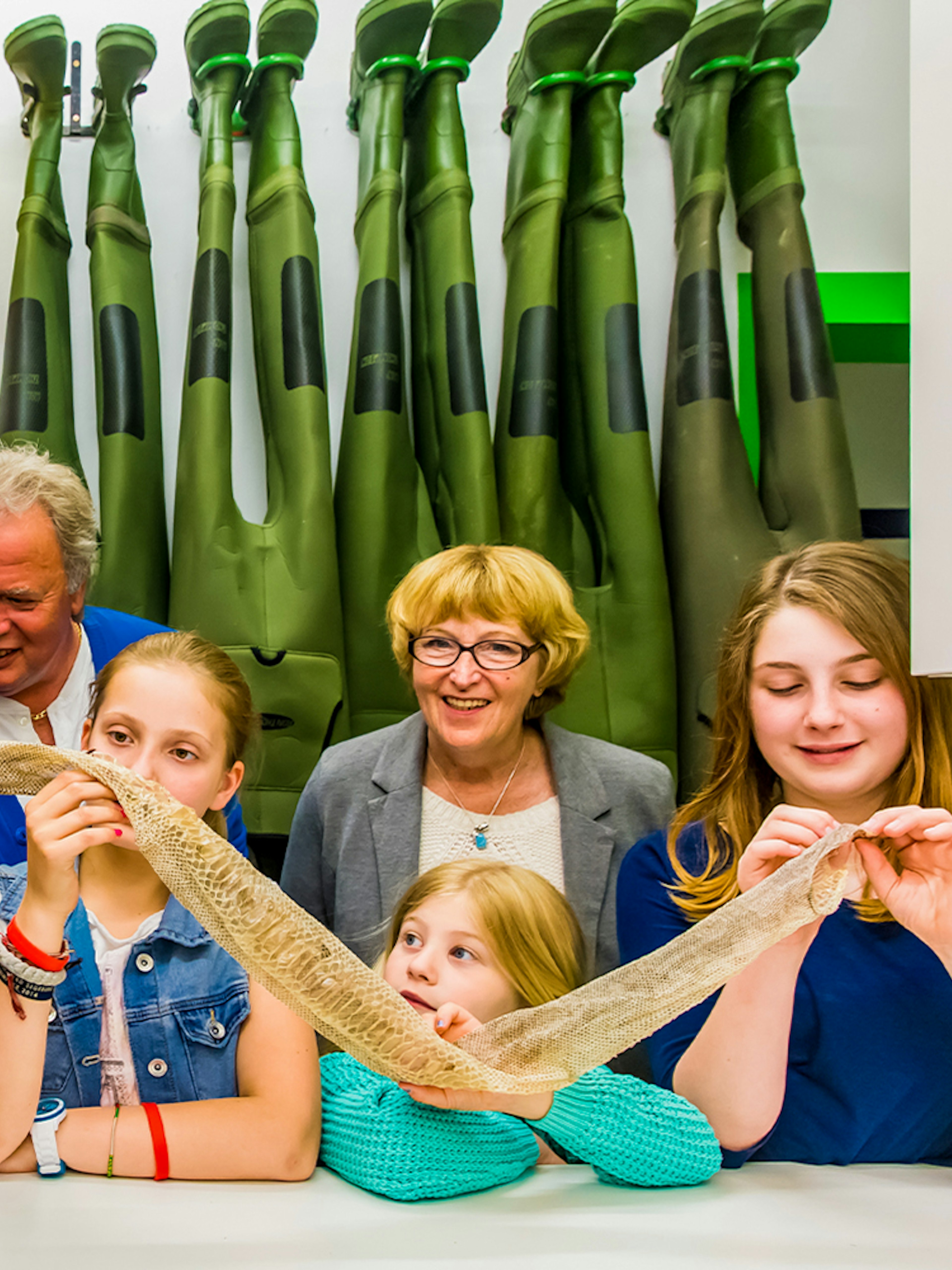 Kids exploring snake skin on SEA LIFE London Behind the Scenes Tour.