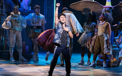 Cast performing a scene from the musical "& Juliet" on stage.