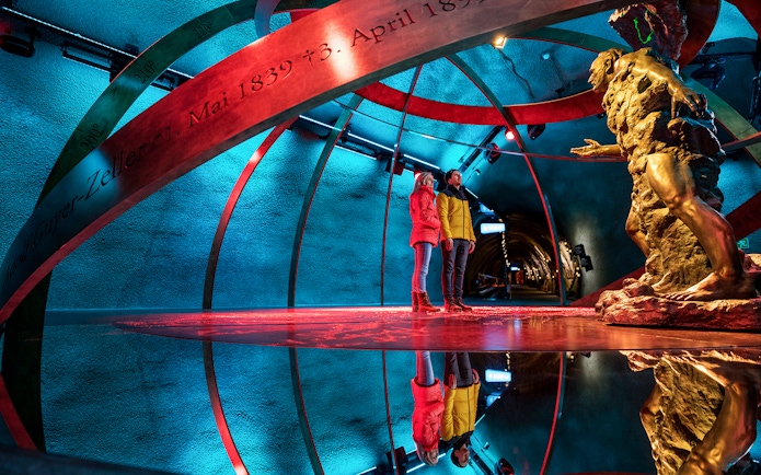 Visitors exploring the Ice Palace at Jungfraujoch, Switzerland.