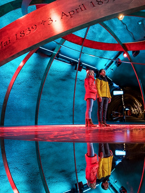 Visitors exploring the Ice Palace at Jungfraujoch, Switzerland.