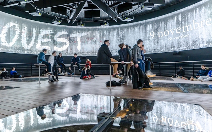 Visitors inside the immersive 360° theater at the Caen Memorial Museum, Normandy, France.