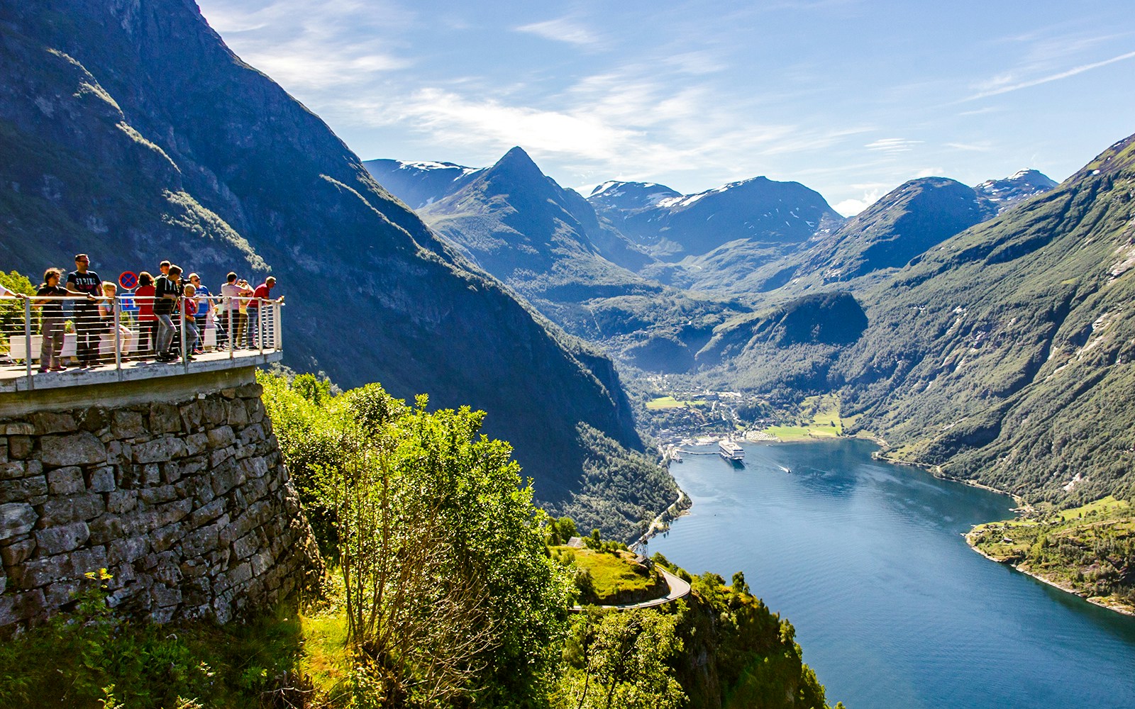 Visitors at Eagle Bend, Ornesvingen viewpoint overlooking Geirangerfjord, Geiranger, Norway.