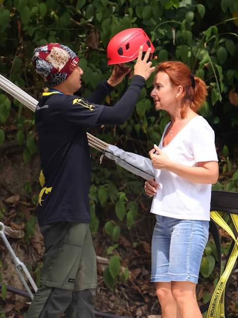 Safety briefing with helmet fitting at Hanuman World, Thailand.