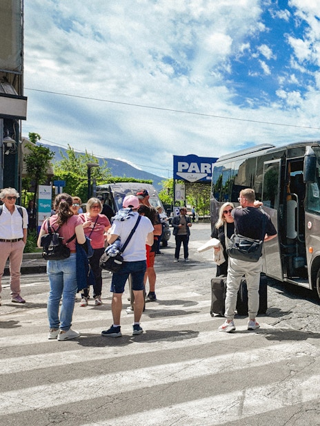 Transfer bus at Mount Vesuvius with tourists boarding.