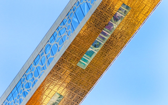 Dubai Frame detail with city skyline reflection, showcasing modern architecture in Dubai, UAE.