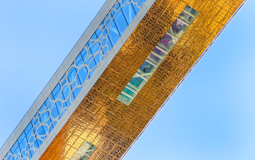 Dubai Frame detail with city skyline reflection, showcasing modern architecture in Dubai, UAE.