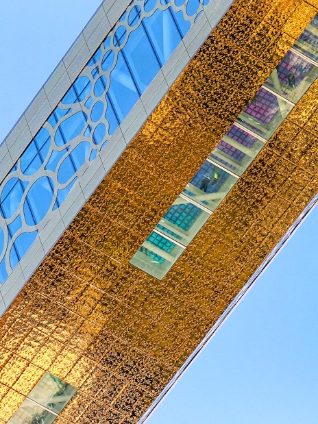 Dubai Frame detail with city skyline reflection, showcasing modern architecture in Dubai, UAE.