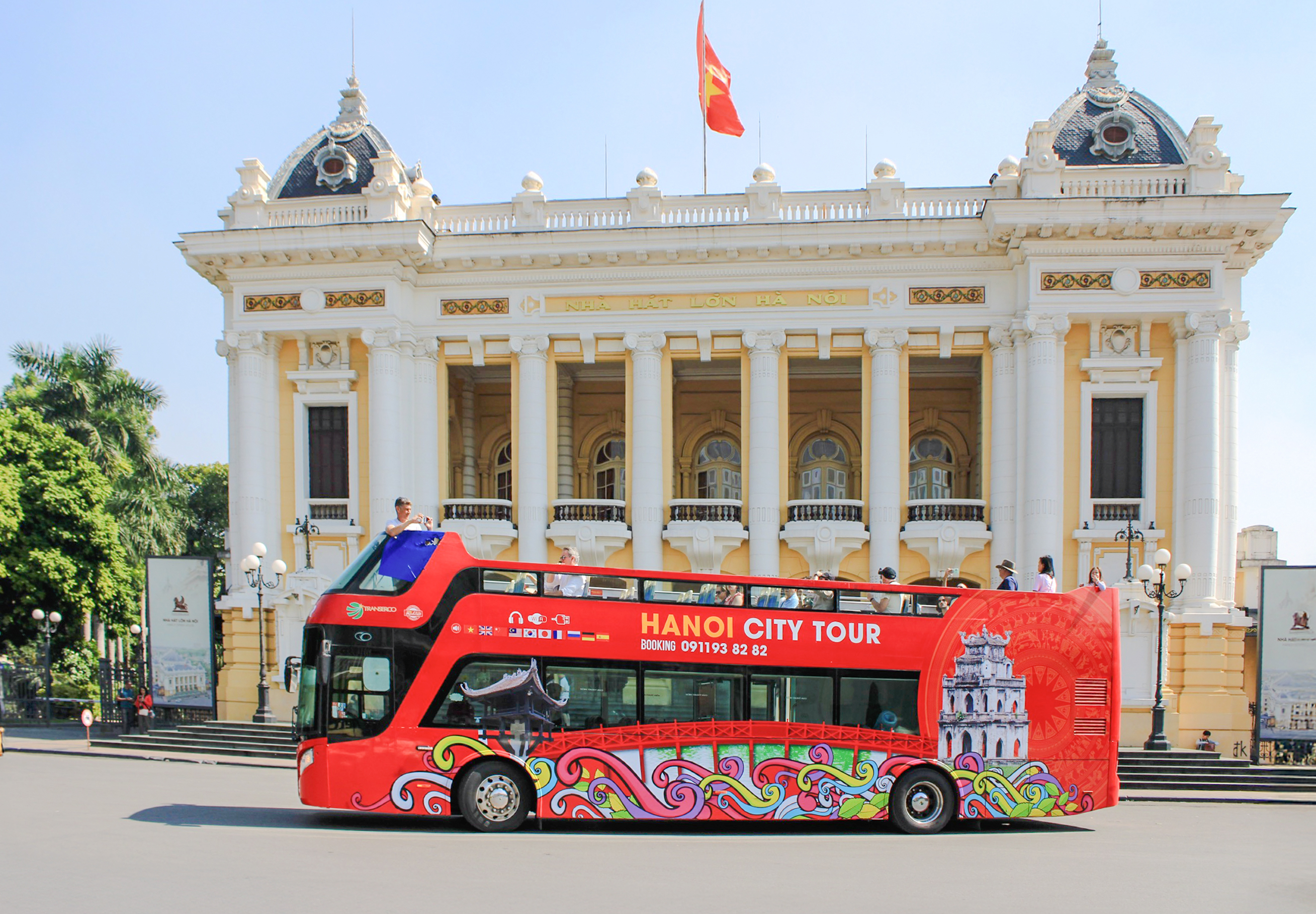 Hop on hop off bus in front of Hanoi Opera House, Hanoi, Vietnam.
