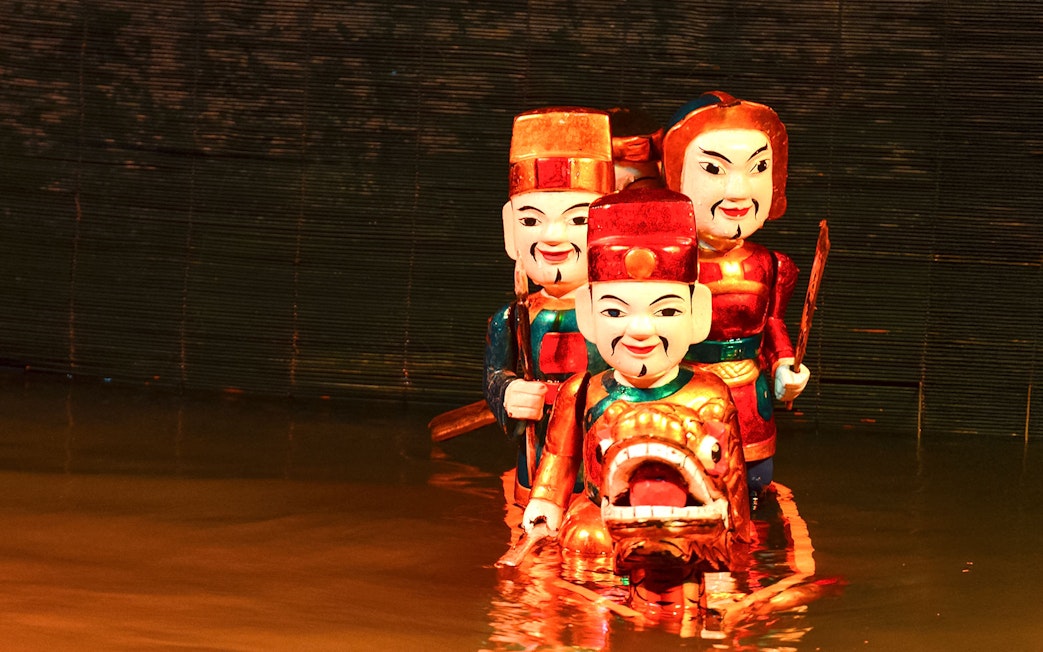 Water puppets performing at Golden Water Puppet Show in Vietnam.