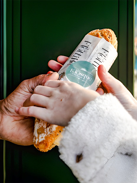 Tourists receiving Flottille's snack wrap in Paris, France.