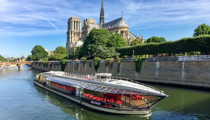 Tourists enjoying a 1-hour Seine River sightseeing cruise Bateaux Parisiens in Paris,