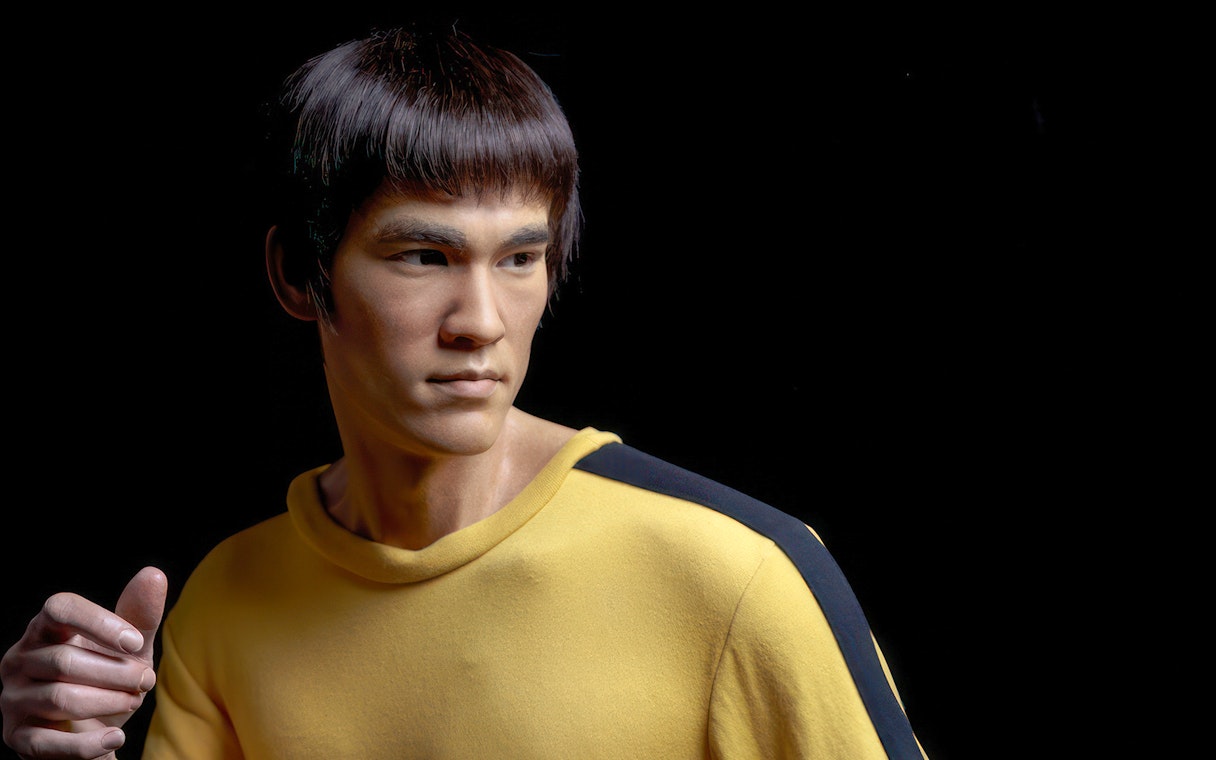 Wax figure in yellow outfit at Madame Tussauds Tokyo.