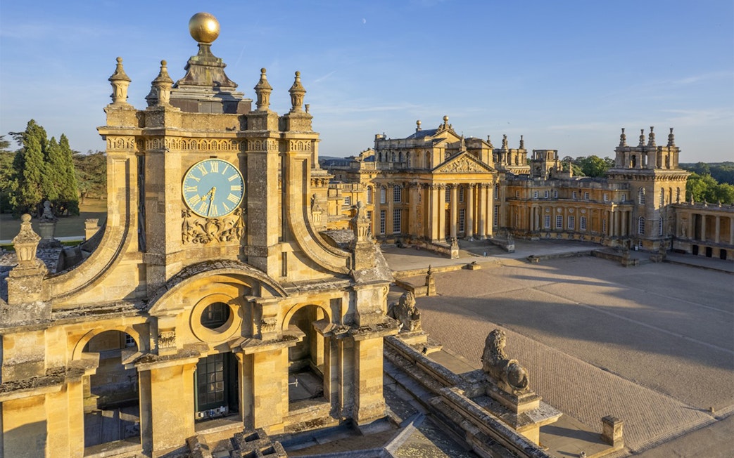 Blenheim Palace courtyard with clock tower and historic architecture in Oxfordshire, England.