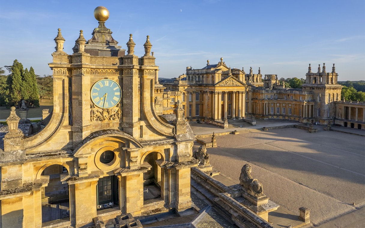 Blenheim Palace courtyard with clock tower and historic architecture in Oxfordshire, England.