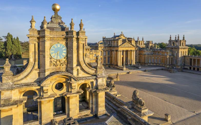 Blenheim Palace courtyard with clock tower and historic architecture in Oxfordshire, England.