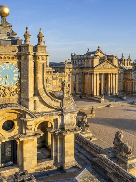 Blenheim Palace courtyard with clock tower and historic architecture in Oxfordshire, England.
