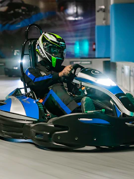 Go-kart racing at Ekart Dubai Mall indoor track.