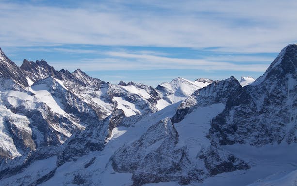 Snow-covered peaks of the Swiss Alps on the Top of Europe Small Group Tour.
