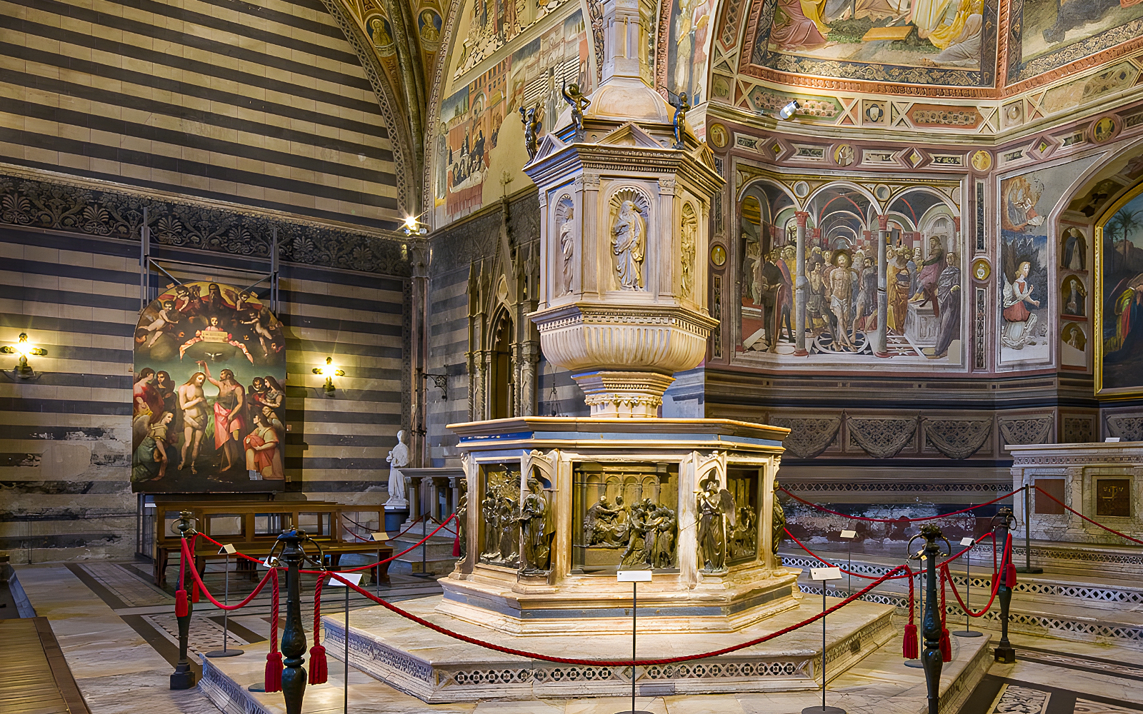 Siena Duomo interior with ornate pulpit and frescoes, part of OPA SI Pass tour.