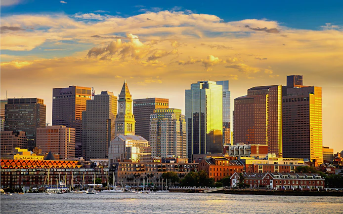 Boston skyline with Custom House Tower at sunset.