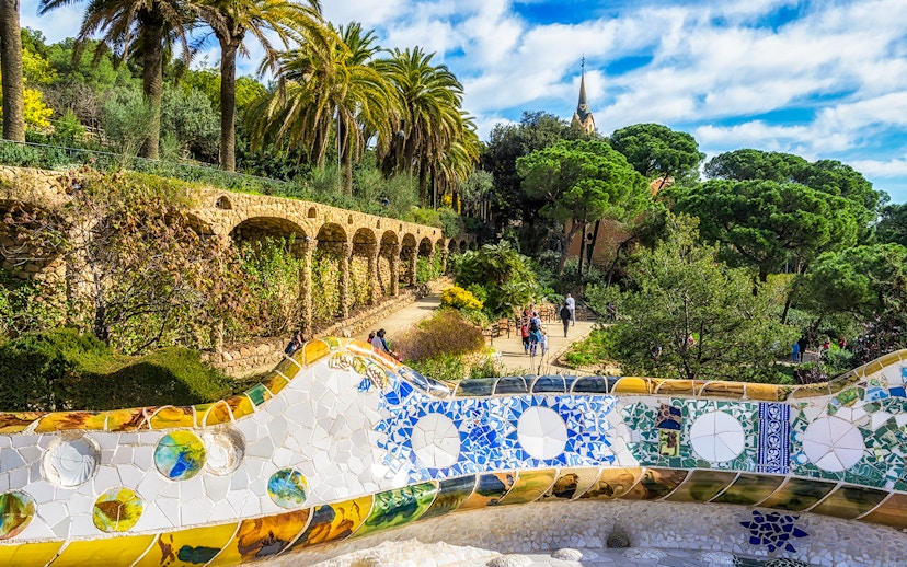 Serpentine benches in Park Güell with view of Greek Theatre, Barcelona.