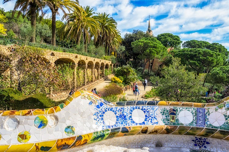 serpentine benches of park guell and view of Greek theatre